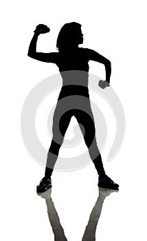 Fitness: Silhouette of athletically fit woman doing curls with dumbbells