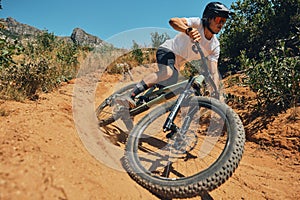 Fitness, speed and extreme sports with man on mountain bike for adventure, cycling and adrenaline junkie. Exercise, risk