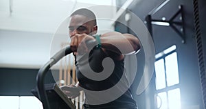 Fitness, spin class and black man in gym for training, intense workout and exercise for healthy body. Sports, cardio
