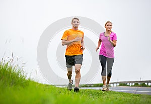 Fitness sport couple running jogging outside