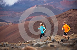 Fitness sport couple running jogging outside on trail