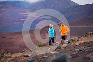 Fitness sport couple running jogging outside on trail