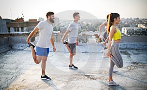 Fitness, sport, friendship and healthy lifestyle concept . Group of happy people exercising