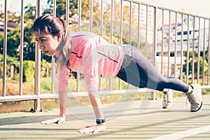 Fitness sport girl fashion sportswear doing yoga fitness exercise in street.