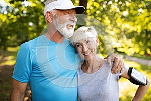 Fitness, sport, people, exercising and lifestyle concept - senior couple running