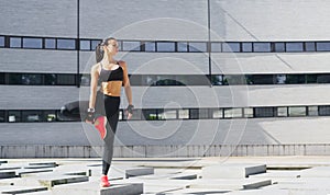 Fitness, sport, urban jogging and healthy lifestyle concept. Young woman training outdoor.