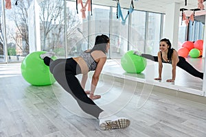 Fitness sport for yonug woman who doing exercise with fit ball at gym