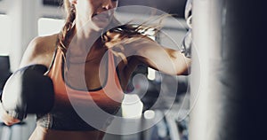 Fitness, sports and boxing with woman in gym for training, workout and real mma challenge. Performance, energy and power