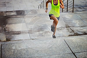 Fitness sports woman running up on city stairs