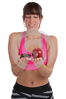 Fitness sports young fit slim woman diet losing weight apple fruit chocolate