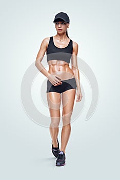 Fitness sporty woman walking on white background