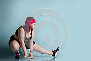 Fitness spring diet weight loss concept. Lucky plus-size girl overweight woman dieting working out doing stretching exercises