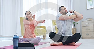 Fitness, stretching and couple doing pilates in the living room together for body, mind and spiritual wellness. Calm