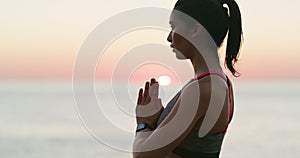 Fitness, sunset and woman doing yoga on a beach for outdoor health, wellness and zen mindset. Meditation, calm and