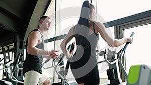 Fitness Support Young Woman Receives Personalized Training from Male Trainer