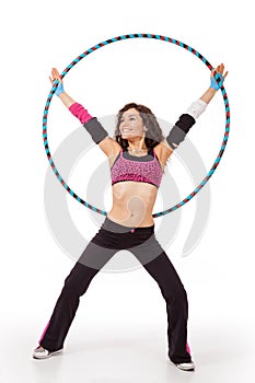 Fitness teacher posing with hula hoop