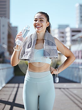 Fitness, tired and water bottle of woman in urban city portrait happy with workout results or exercise in summer