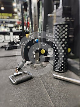 This fitness tool connects the handles to the pile of weights by pulling the cable so that it moves through the pulley.