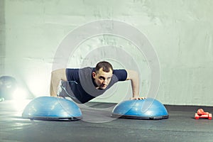 Fitness trainer in the gym shows exercises