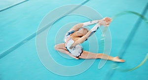 Fitness, training with a gymnastics hoop and a woman in the gym for a performance showcase or practice. Dance, energy