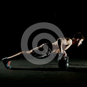 Fitness training. Man doing push ups exercise.