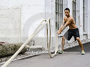 Fitness training outdoors with ropes