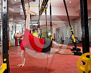 Fitness TRX training exercises at gym woman and man