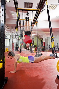 Fitness TRX training exercises at gym woman and man