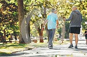 Fitness, walking and elderly men in park for wellness, healthy body and wellbeing in retirement, Friends, happy and