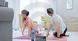 Fitness, wellness and couple doing yoga in the living room together for body, mind and spiritual health. Calm