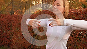 Fitness woman dancing on ballet class in autumn park. Sport woman training dance exercise in autumn park. Slow motion