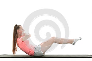 Fitness woman doing exercise to strengthen the abdominal muscles