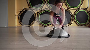 Fitness woman doing jumping push ups exercise at gym