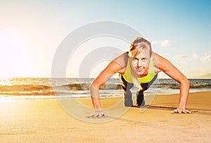 Fitness woman doing push ups