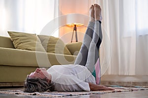 Fitness woman doing stretch exercise stretching her body.
