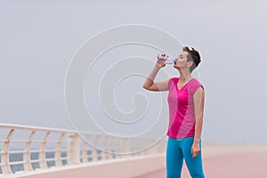 Fitness woman drinking water