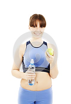 Fitness woman eating apple smiling happy