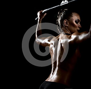 Fitness woman execute exercise on black background