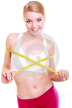 Fitness woman fit girl with measure tape measuring her bust