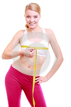 Fitness woman fit girl with measure tape measuring her bust