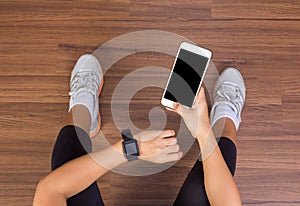 Fitness woman hand with wearing watchband touchscreen smartwatch photo