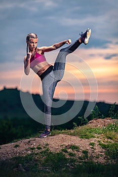 Fitness Woman on Hills at Sunset