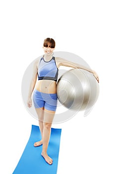 Fitness woman holding exercise pilates ball