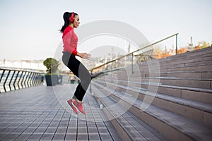 Fitness woman jumping outdoor