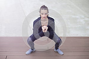 Fitness woman jumping outdoor in urban enviroment