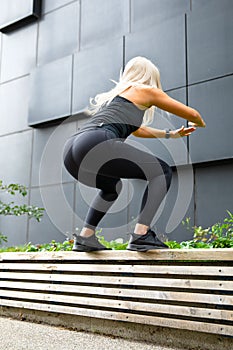 Fitness woman jumping outdoor in urban enviroment