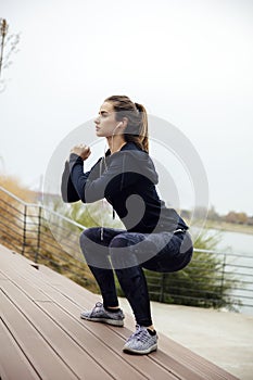 Fitness woman jumping outdoor in urban enviroment