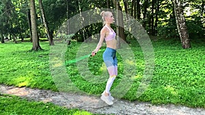 Fitness woman jumping outdoor in urban enviroment