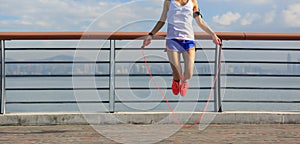 Fitness woman jumping rope