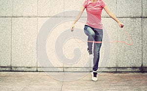 Fitness woman jumping rope outdoor